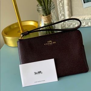 NWT Coach wristlet in rich brown